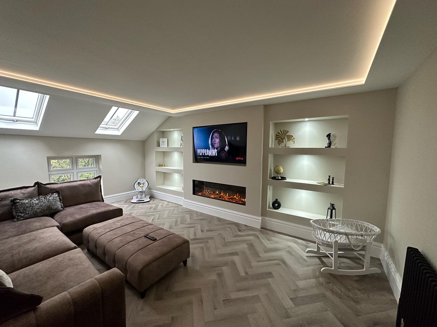 Vaulted loft conversion living suite with twin Velux windows and coffered ceiling