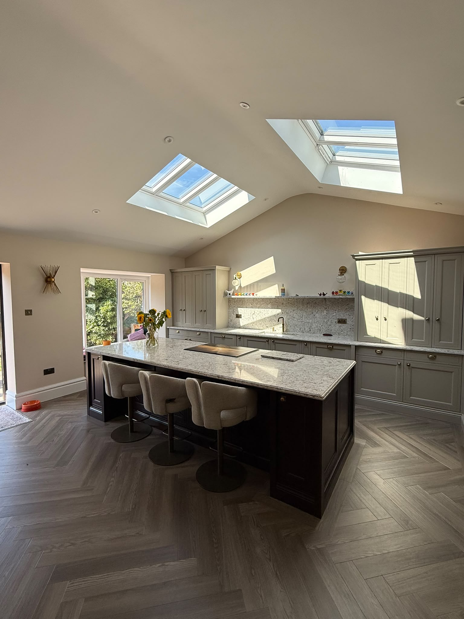 Sage shaker larder cabinetry and vaulted ceiling in Merseyside house extension
